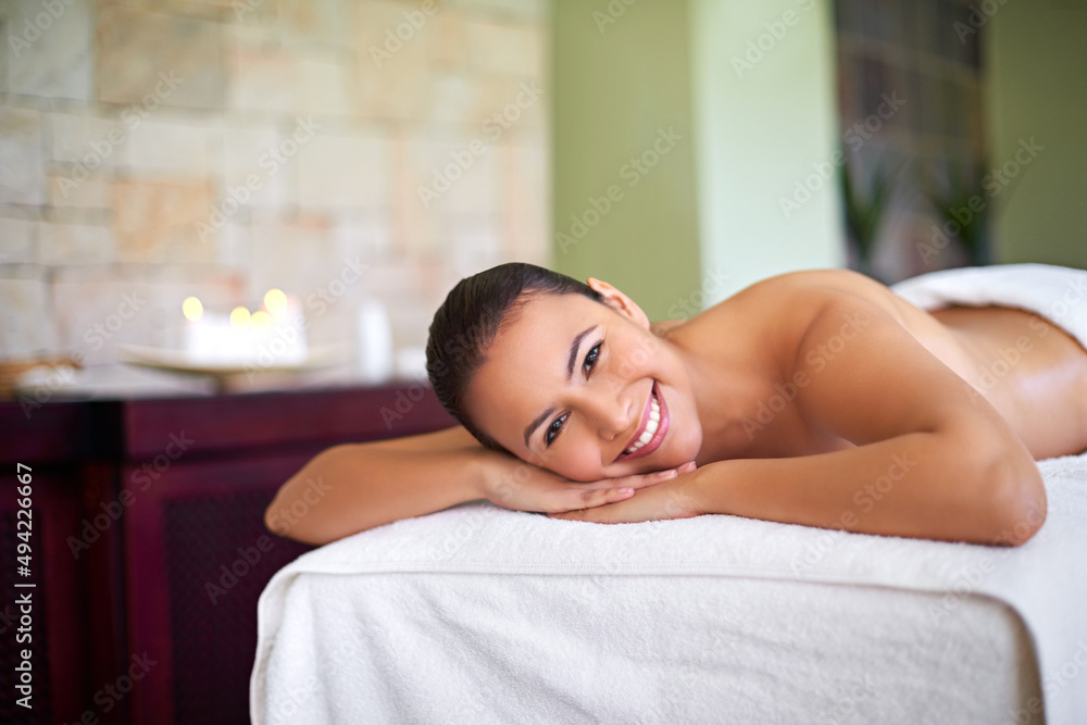 Youre one massage away from a good mood. Shot of an attractive woman enjoying a day at a health spa.