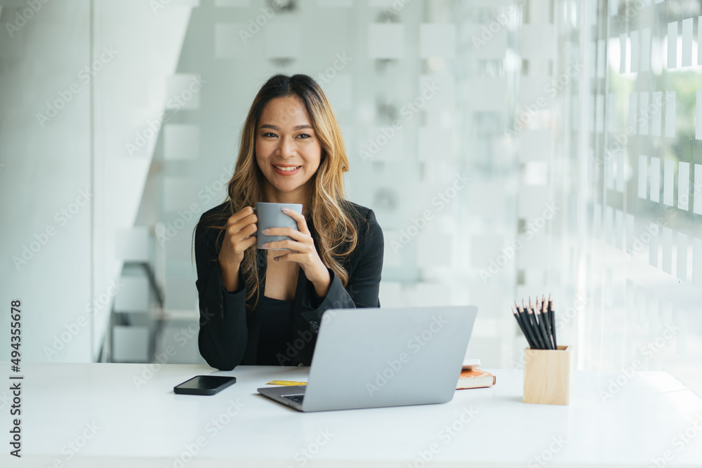 A young woman working with a laptop in a coffee shop business idea financial girl accountant