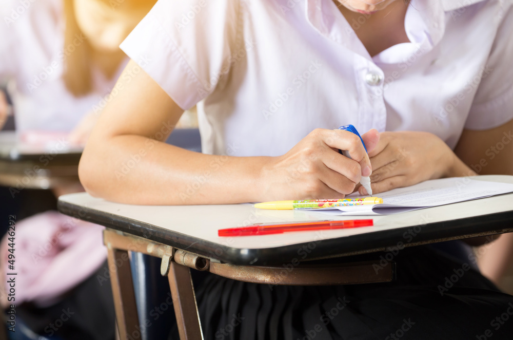 high school,university student study.hands holding pencil writing paper answer sheet.sitting lecture