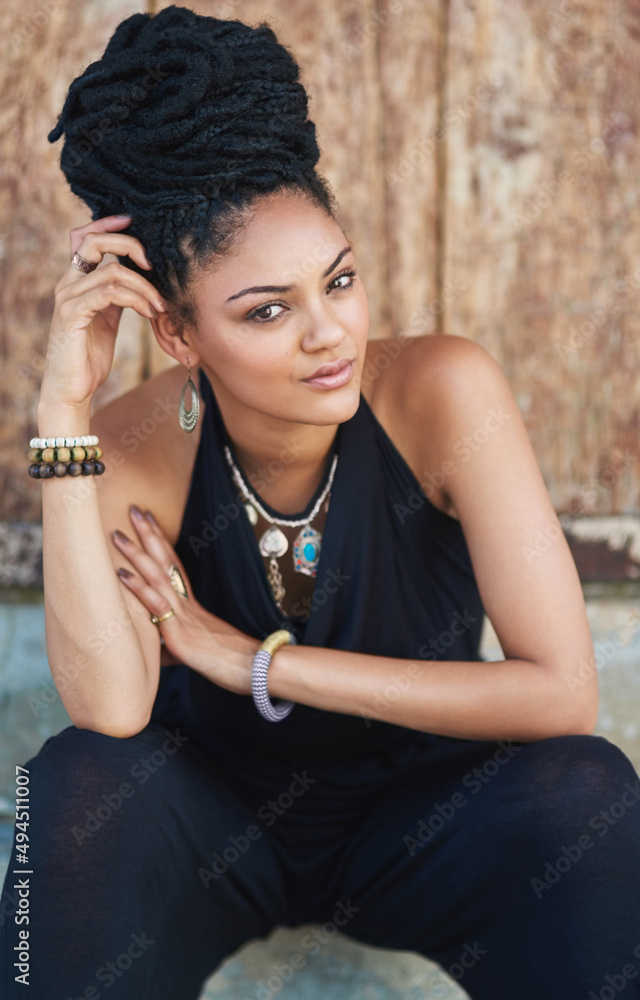 Her beauty comes from her confidence. Portrait of an attractive young woman posing outdoors.