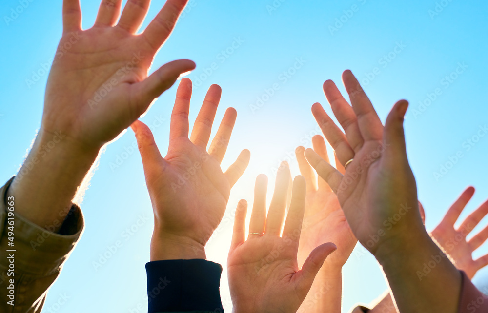 Put your hands in the air and celebrate life. Cropped shot of a group of unrecognizable peoples hand