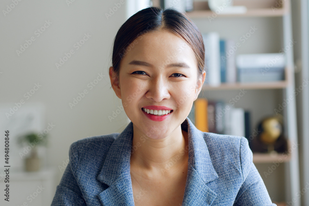 Portrait of young Asian businesswoman working in formal suit look at camera and smile