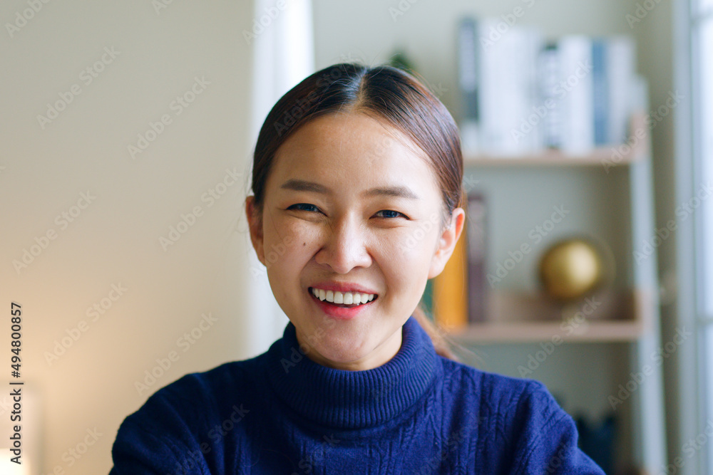 Portrait of young Asian woman smiling and look at camera