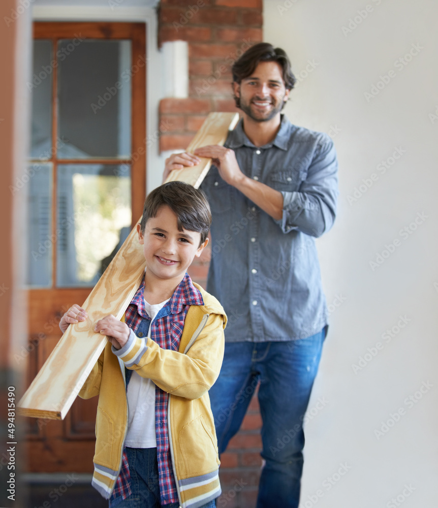 He loves helping his father with home improvements. A young boy helping his father with the home imp