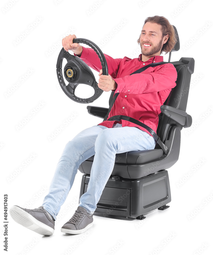 Man in car seat and with steering wheel isolated on white