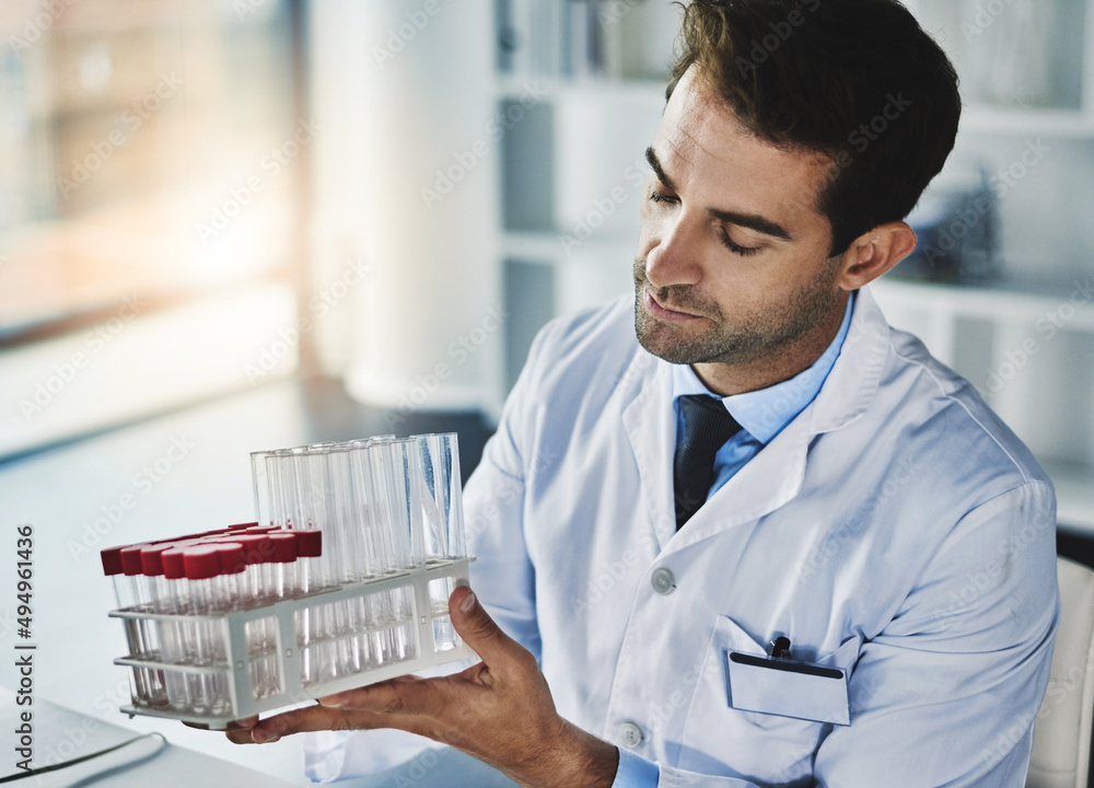 Soon these will be filled with samples. Shot of a scientist analyzing medical samples in a lab.