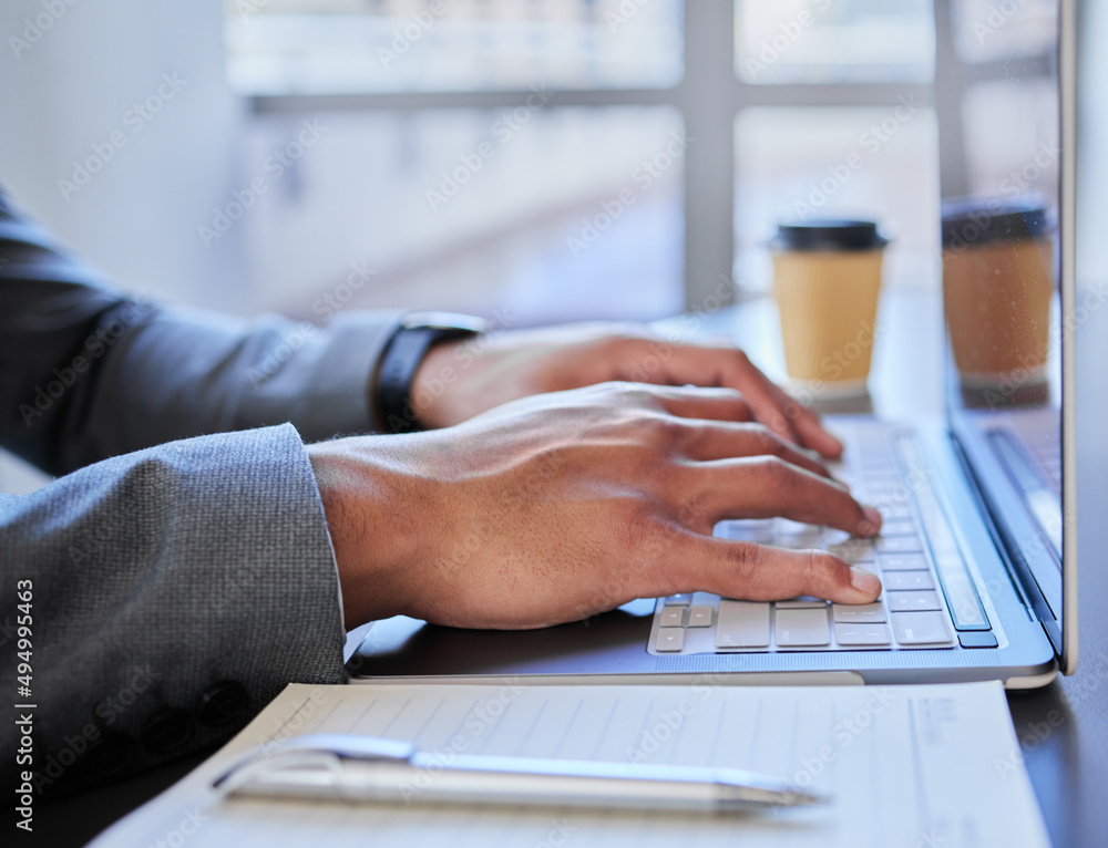 Working hard to achieve my goals. Shot of a businessman using his laptop to do research.