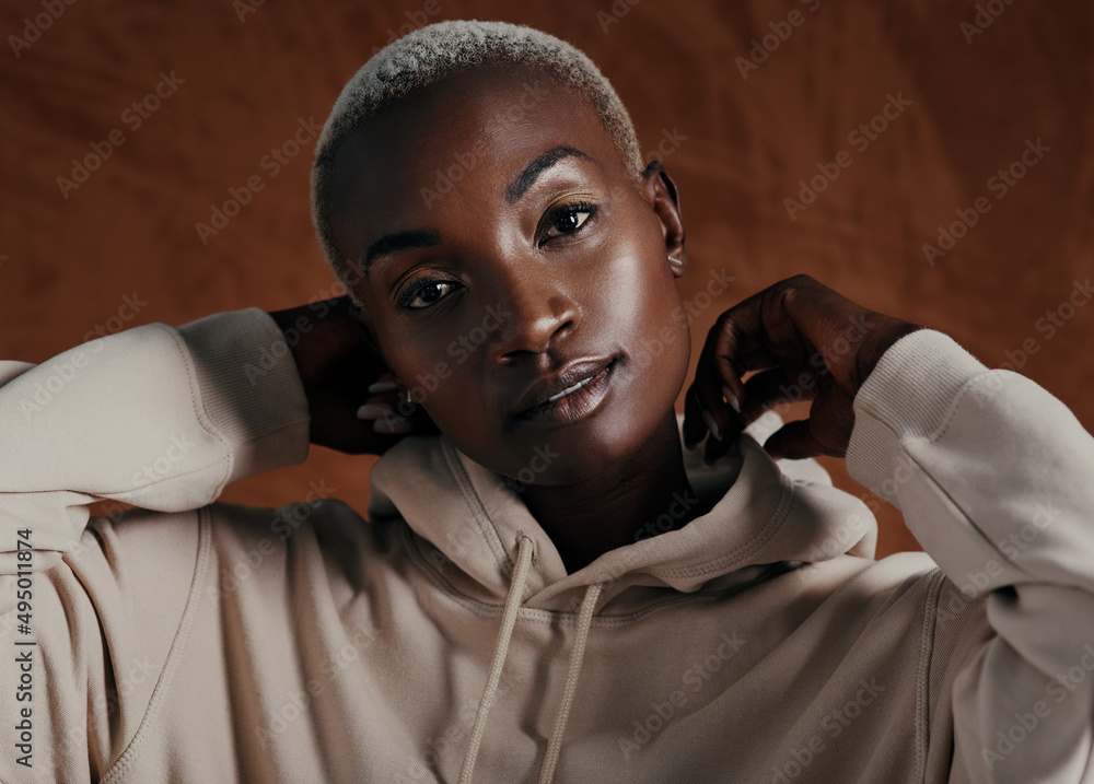 Be bold, because youre beautiful. Studio portrait of an attractive young woman wearing a hoodie and 