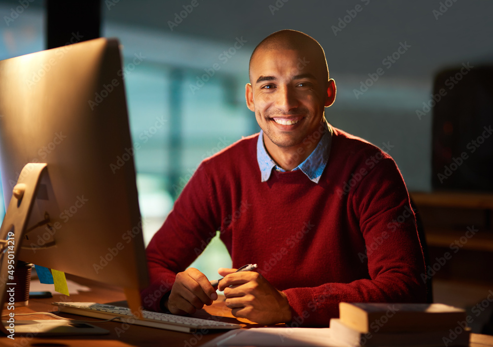 Ill put in whatever work is necessary. Portrait of a handsome young man working late in his office.