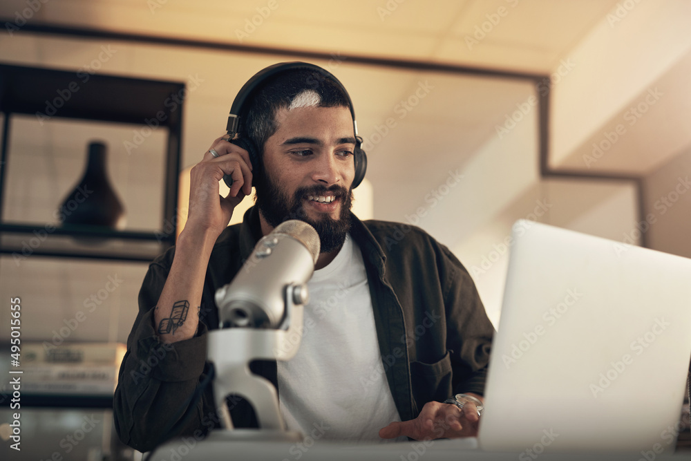 Stay tuned for more awesome topics. Shot of a young man using a headset, microphone and laptop durin