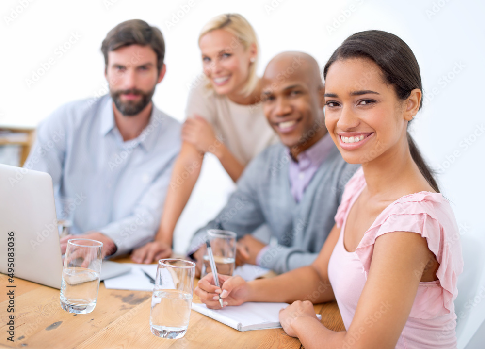 Teamwork at the office. Shot of smiling business people in a business meeting.