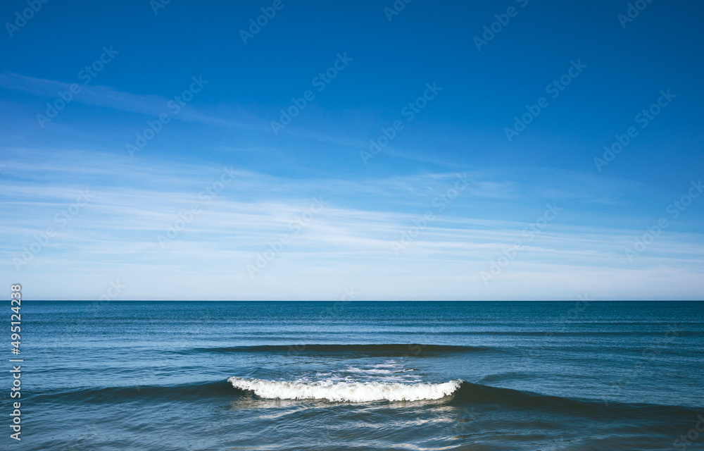 Tranquil seascape with calm sea and blue sky