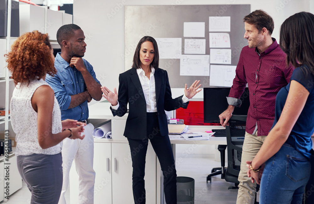 It all comes down to marketing. Shot of a group of office workers in a meeting.