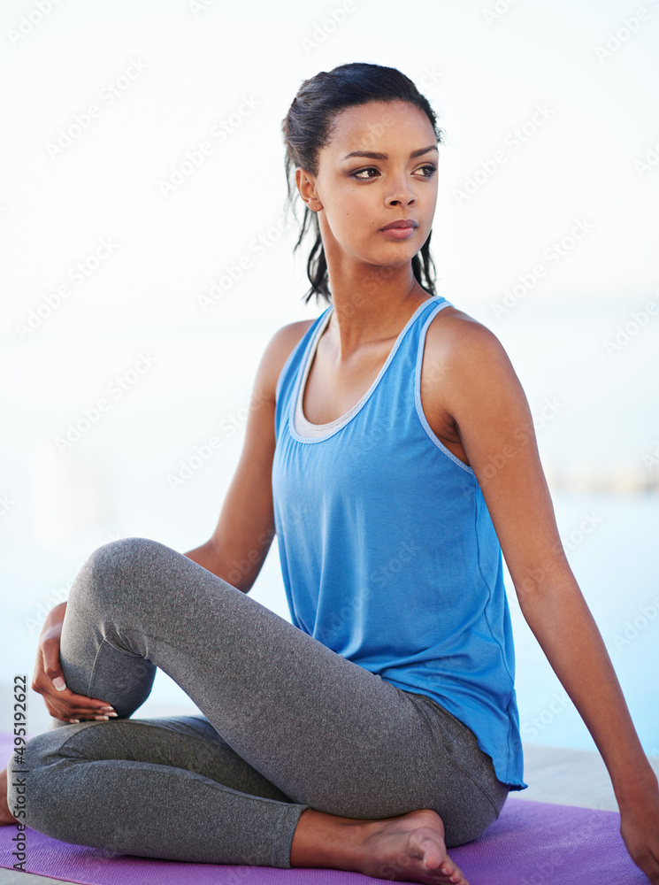 Building a strong mind and body. Shot of a young woman doing yoga.