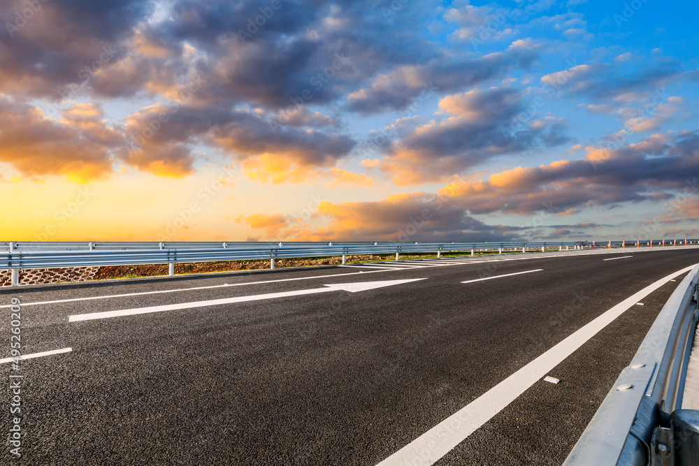 Asphalt road and colorful sky cloud landscapes at sunrise