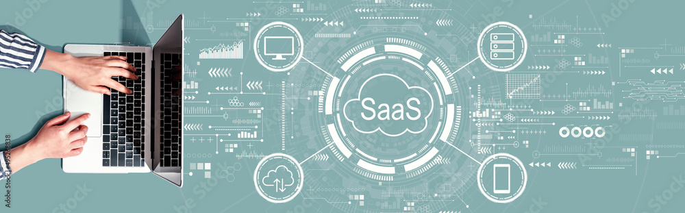 SaaS - software as a service concept with person using a laptop computer