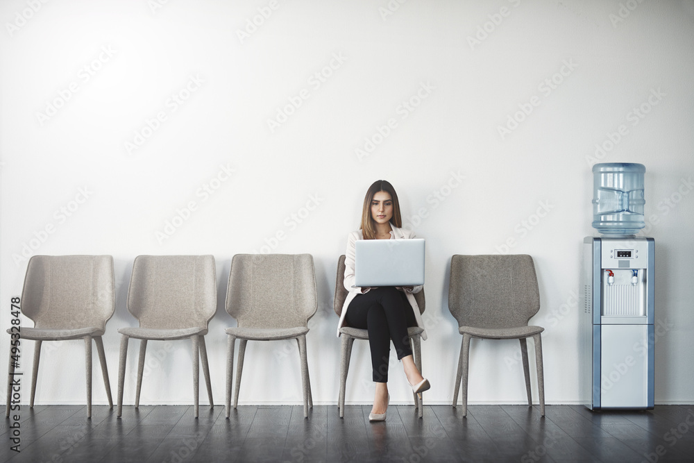 This job is mine. Studio shot of a businesswoman waiting in line against a white background.