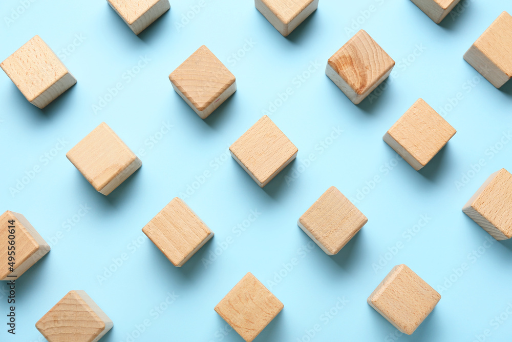 Wooden cubes on blue background