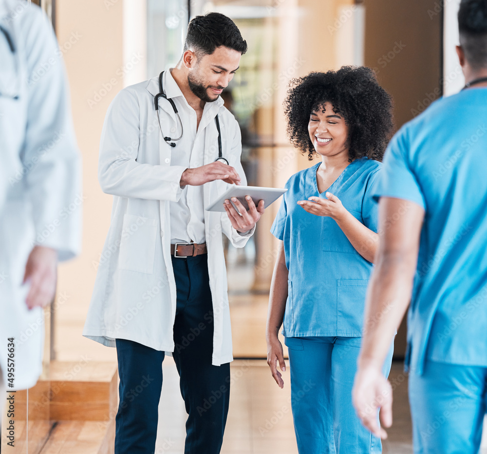 Digital diagnosis is faster diagnosis. Shot of two young doctors using a tablet and having a discuss