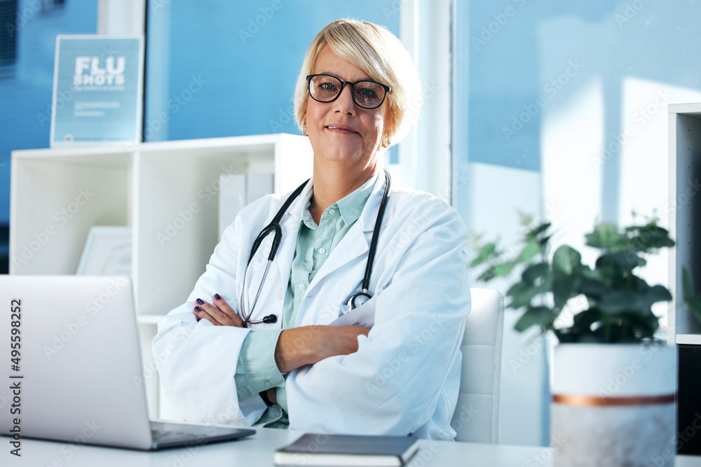 As a caregiver, you see selfless acts everyday. Shot of a female doctor sitting in her office.