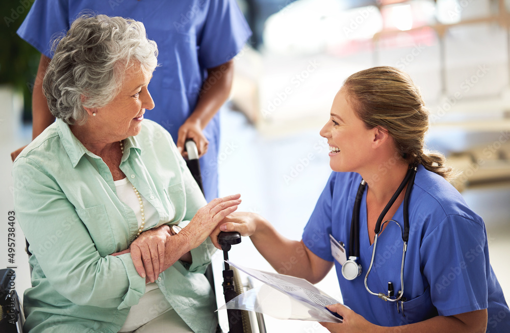 Ive got some good news for you. Shot of a doctor discussing treatments with a senior woman sitting i