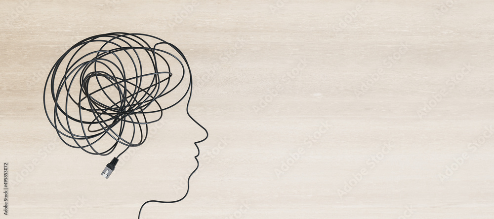 Abstract head and brain scribble outline made of usb cable on wide wooden background with mock up pl