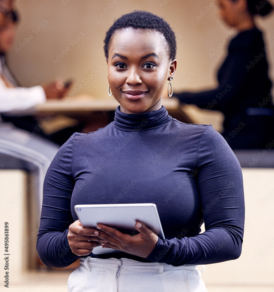 Im ready to lead this business. Shot of an attractive young businesswoman standing in the office and