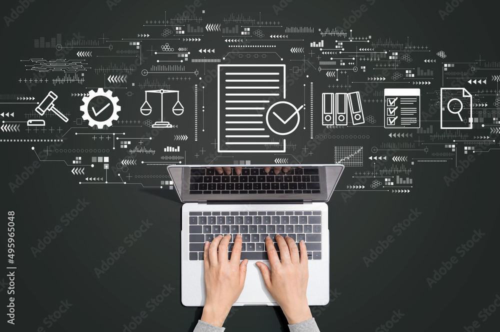 Compliance concept with person using a laptop computer