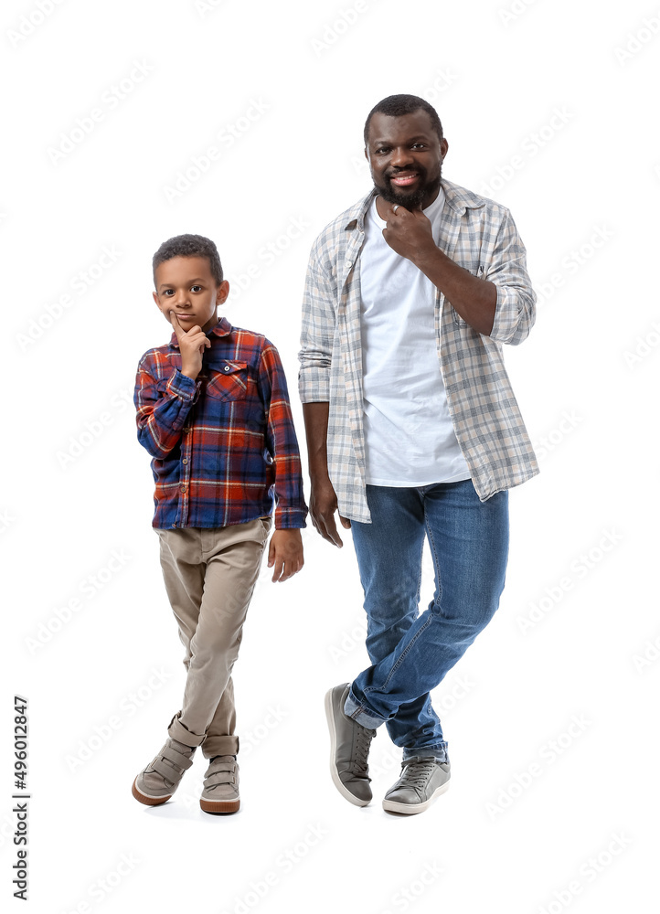 Portrait of African-American man with his little son on white background