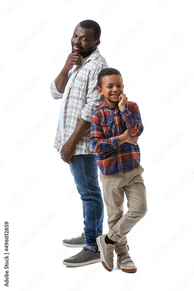 Portrait of African-American man with his little son on white background