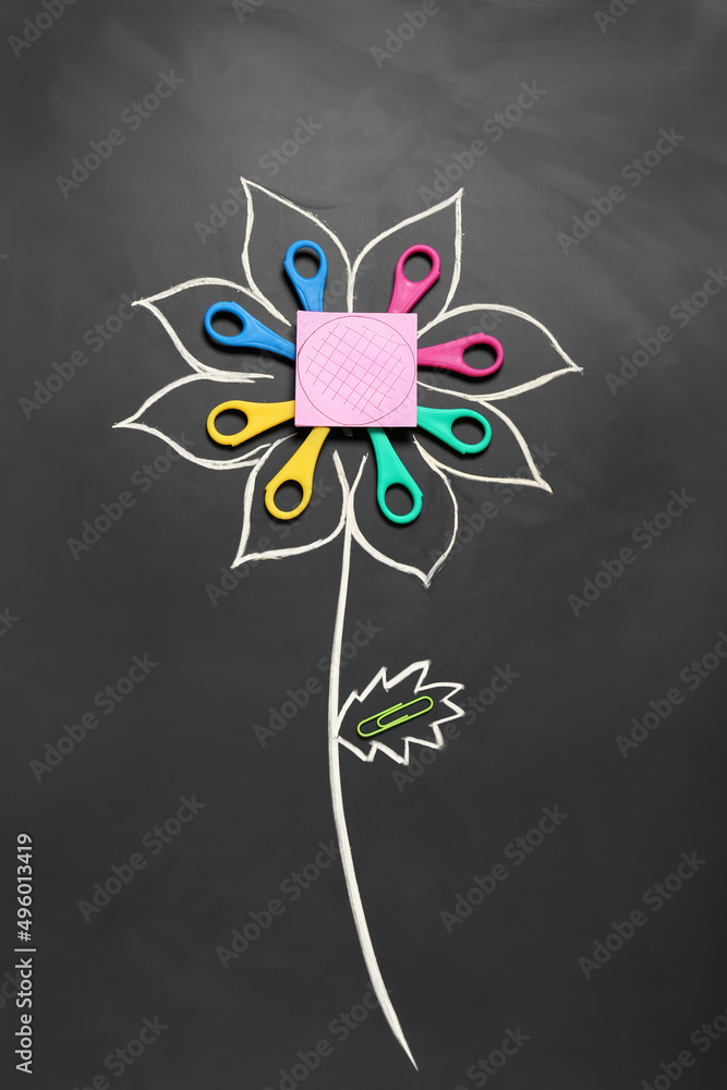 Drawn flower and stationery on dark background