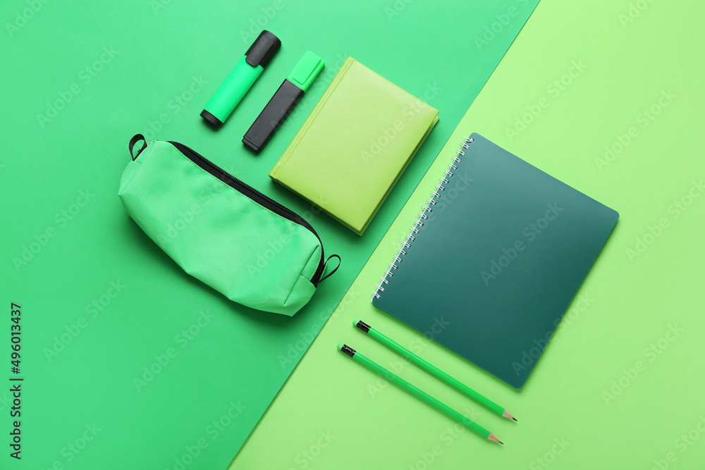 Set of stationery on green background