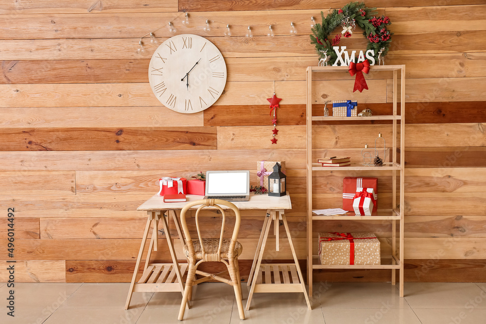 Interior of modern room with workplace and Christmas gifts