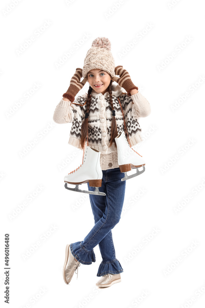 Funny little girl with ice skates on white background