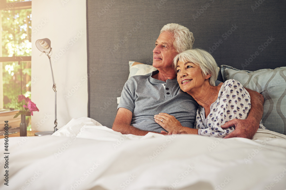 What a beautiful morning.... Shot of a senior couple lying in bed.