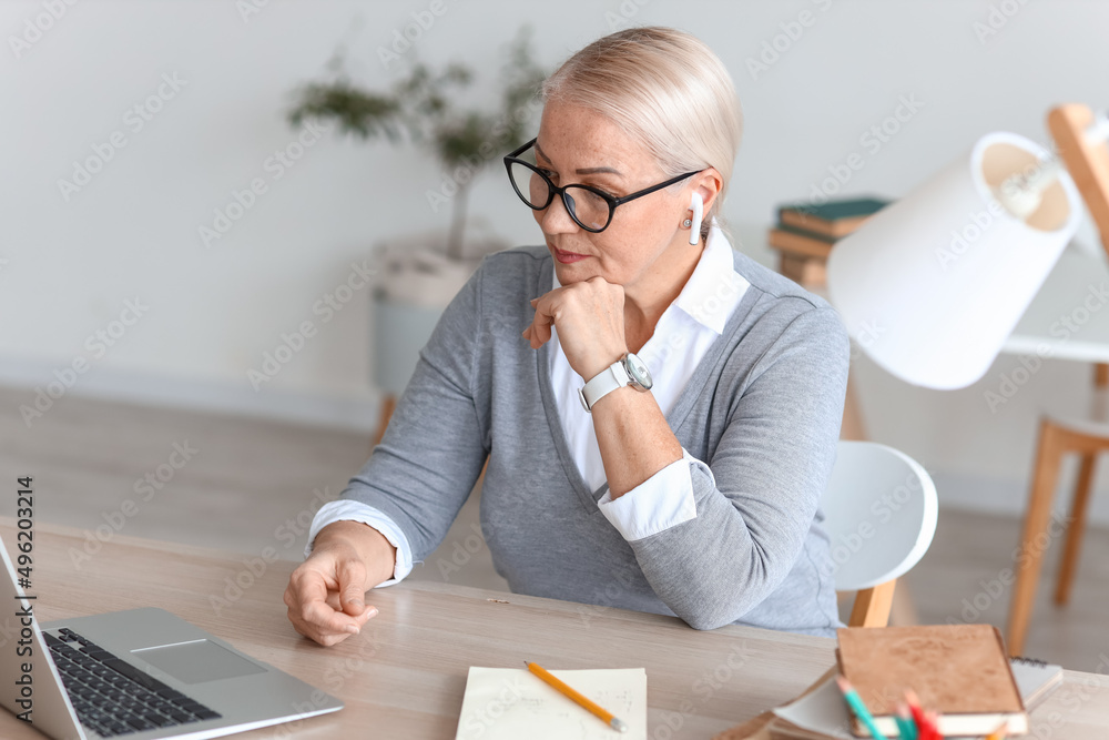 Female tutor giving lesson online