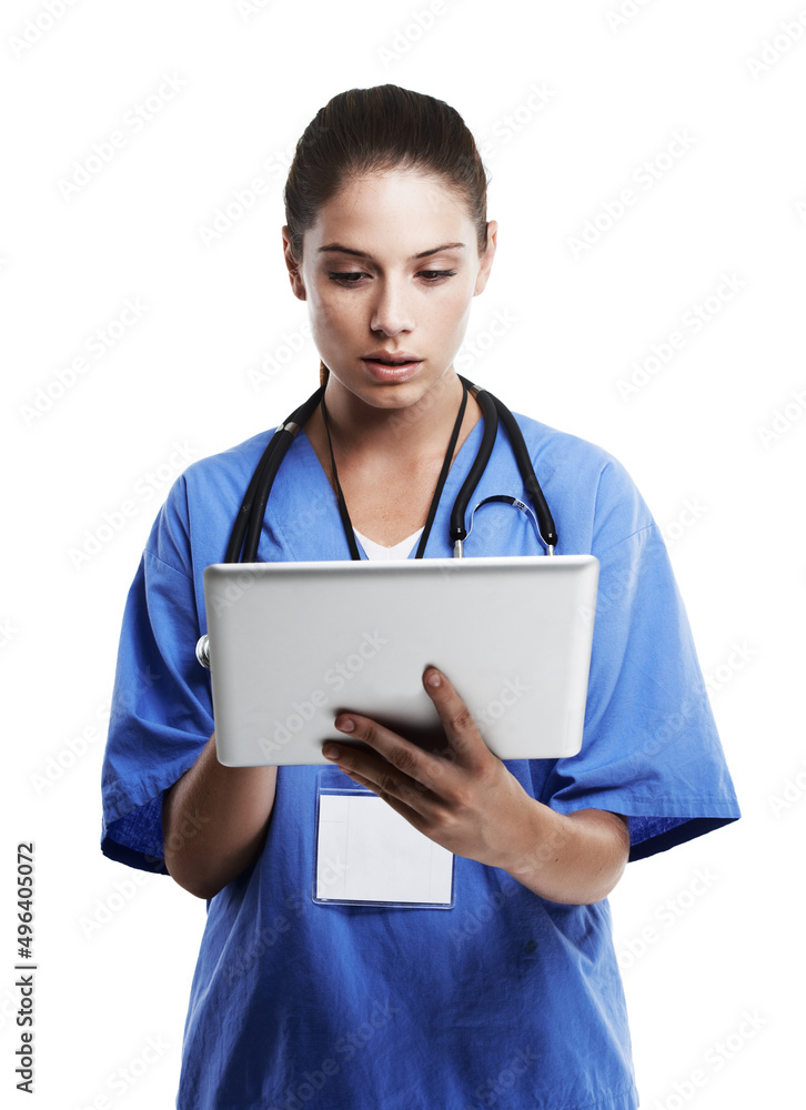 Digital diagnosis. Studio shot of a beautiful young doctor using a digital tablet against a white.