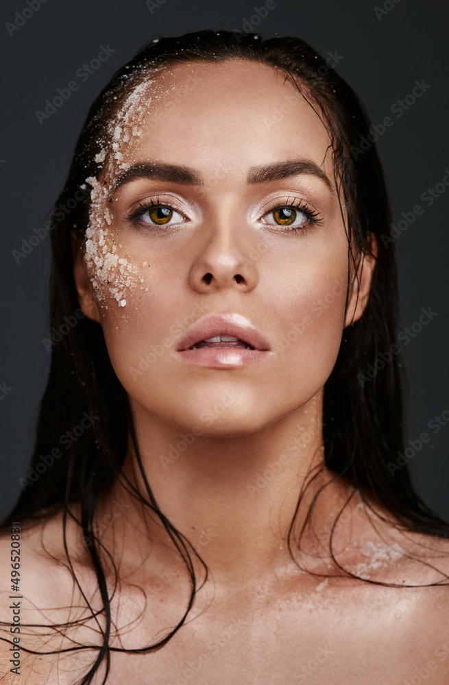 Exfoliating is what keep me shining like a diamond. Shot of a beautiful young woman posing with salt