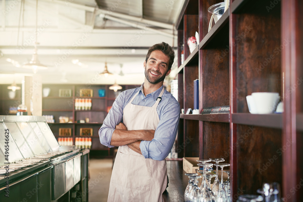 Service with a smile. Cropped portrait of a young barista standing in a coffee shop.