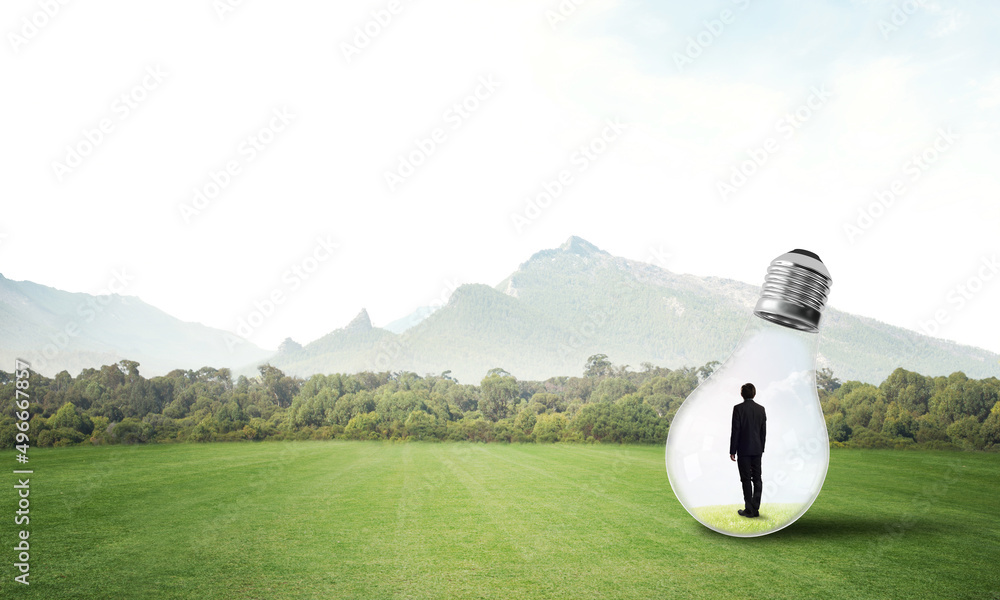 Businessman inside light bulb