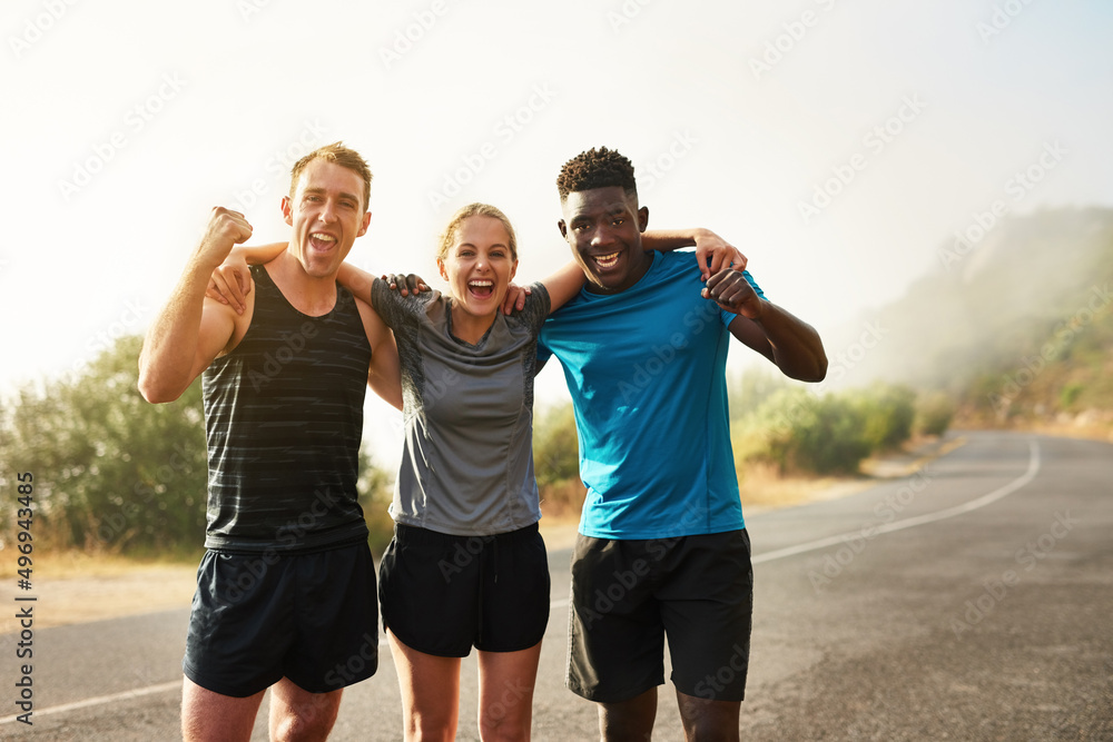 Only those who persevere will become victorious. Portrait of a group of sporty young people celebrat