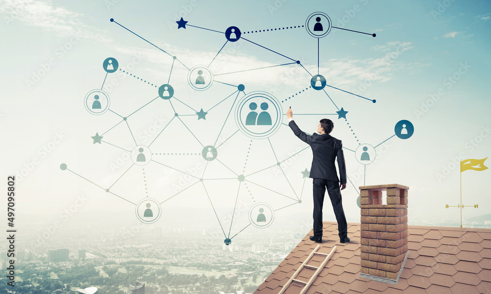 Businessman on house roof presenting networking and connection c