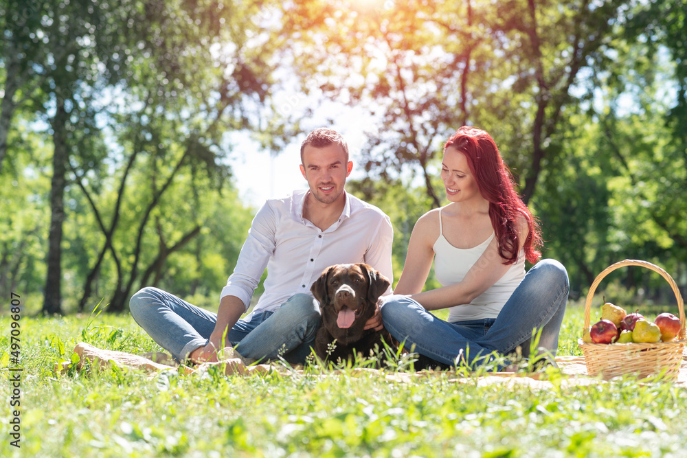 Couple with a dog in the park