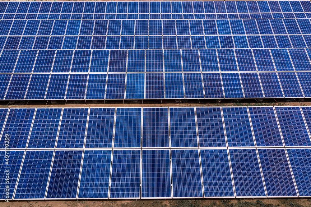 Aerial view of solar panel power plant. Green energy concept.