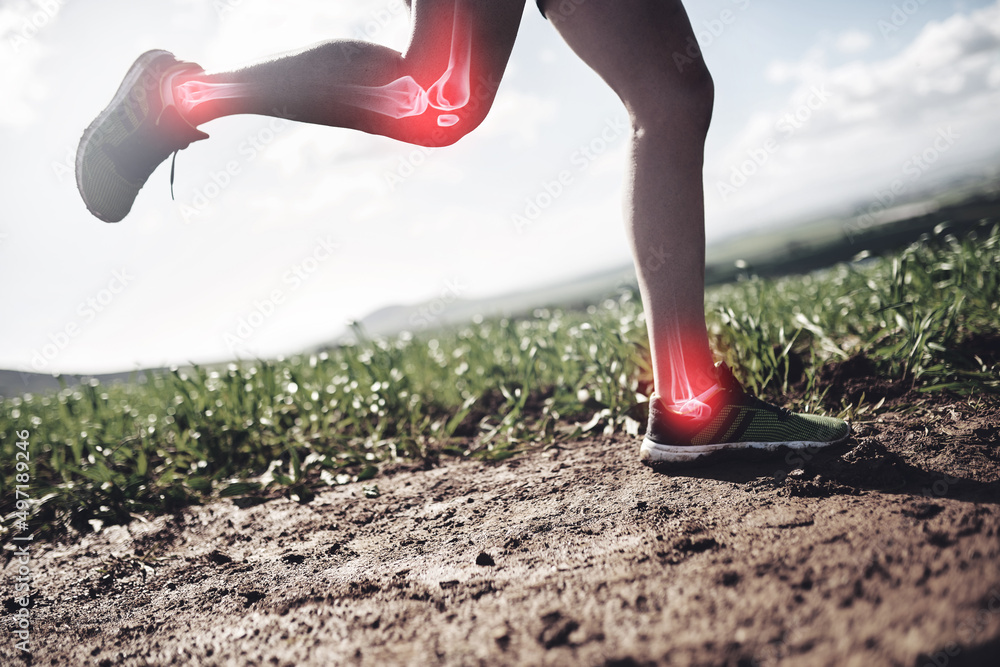 His joints are taking a beating. Shot of an unrecognizable man running with injuries highlighted by 