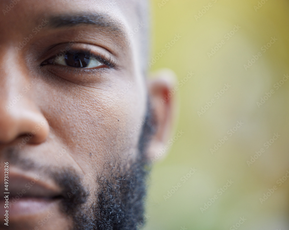 The eyes tell a different story. Closeup shot of one side of a young mans face.