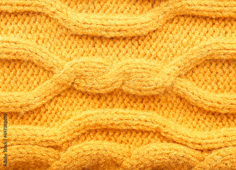 Texture of yellow knitted clothes, closeup