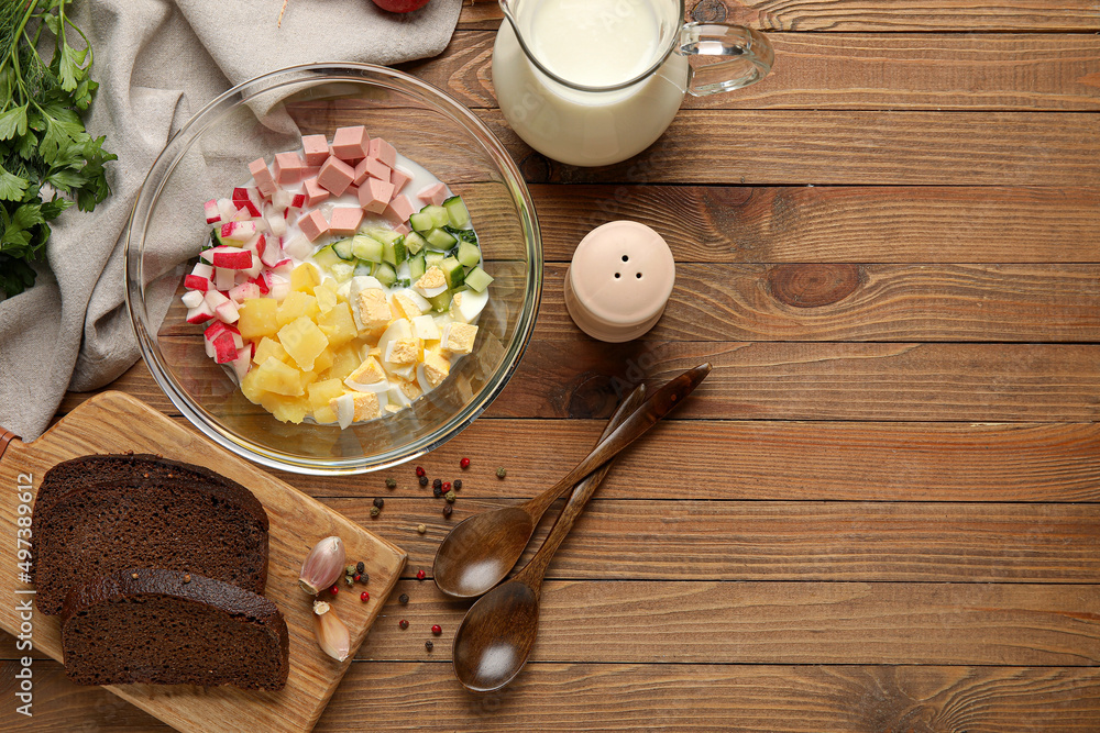 Ingredients for preparing tasty okroshka on wooden background, closeup