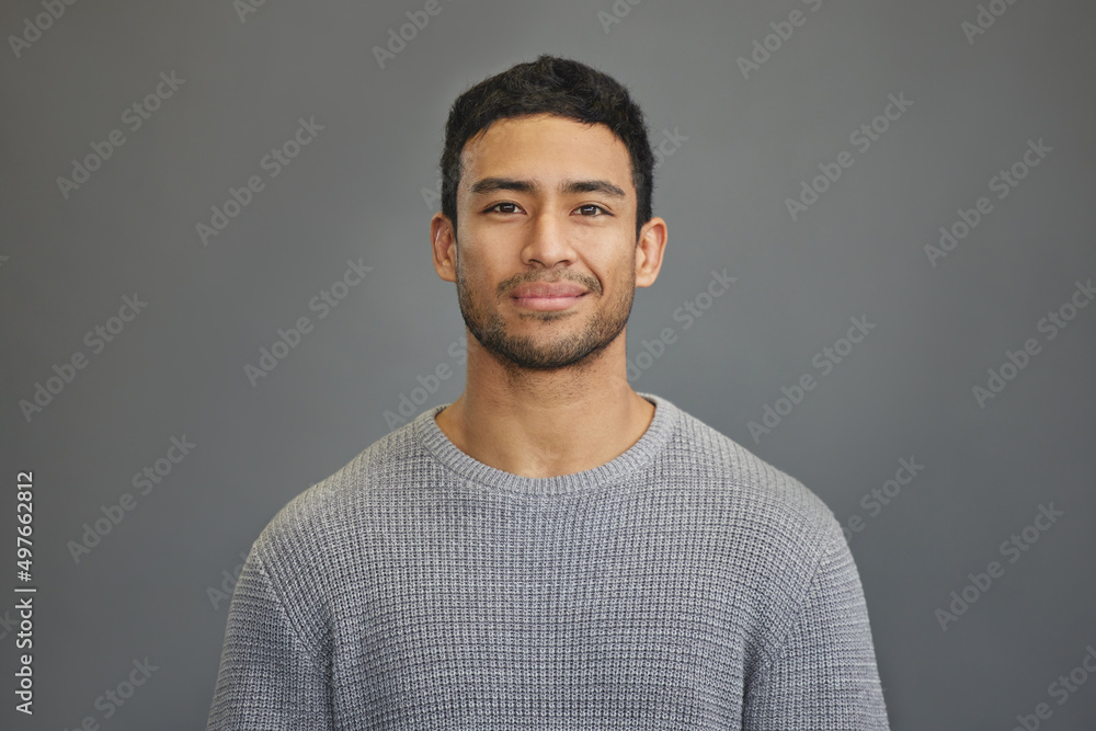 First you have to believe in yourself. Shot of a handsome young man standing against a grey backgrou