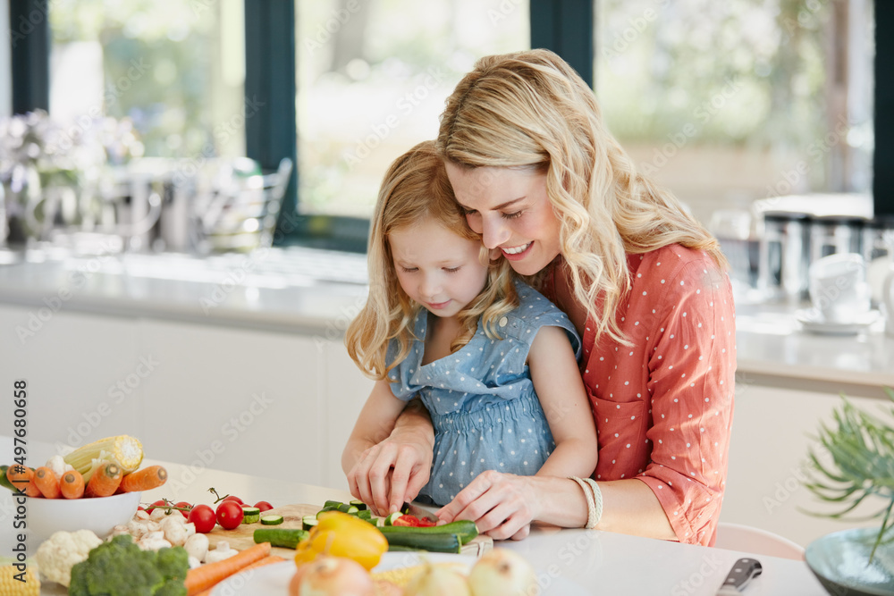 Its all about making the healthy choice. Cropped shot of a mother and daughter preparing a meal toge